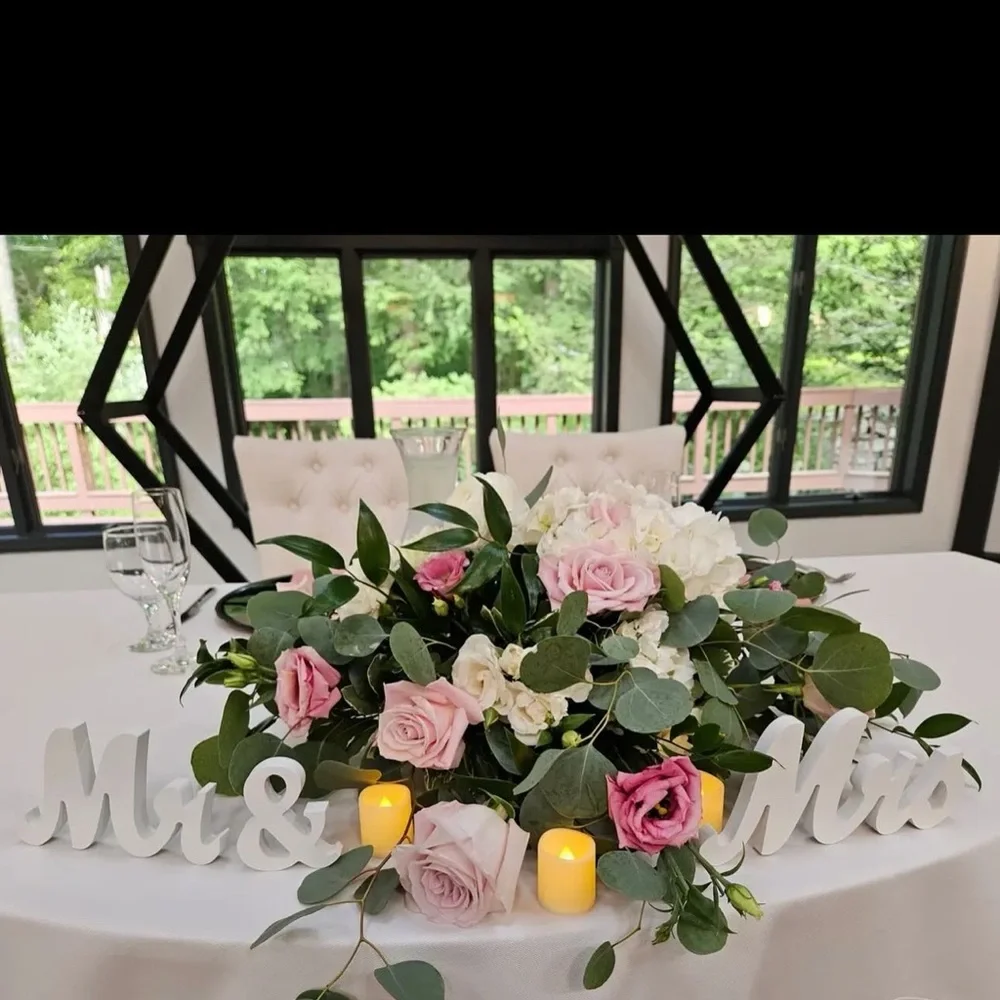 White 'Mr & Mrs' Sign wedding decor. Flowers and candles are not included